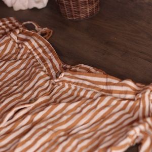 Cute and chic colorful striped blouse. Button up on front. With spaghetti straps